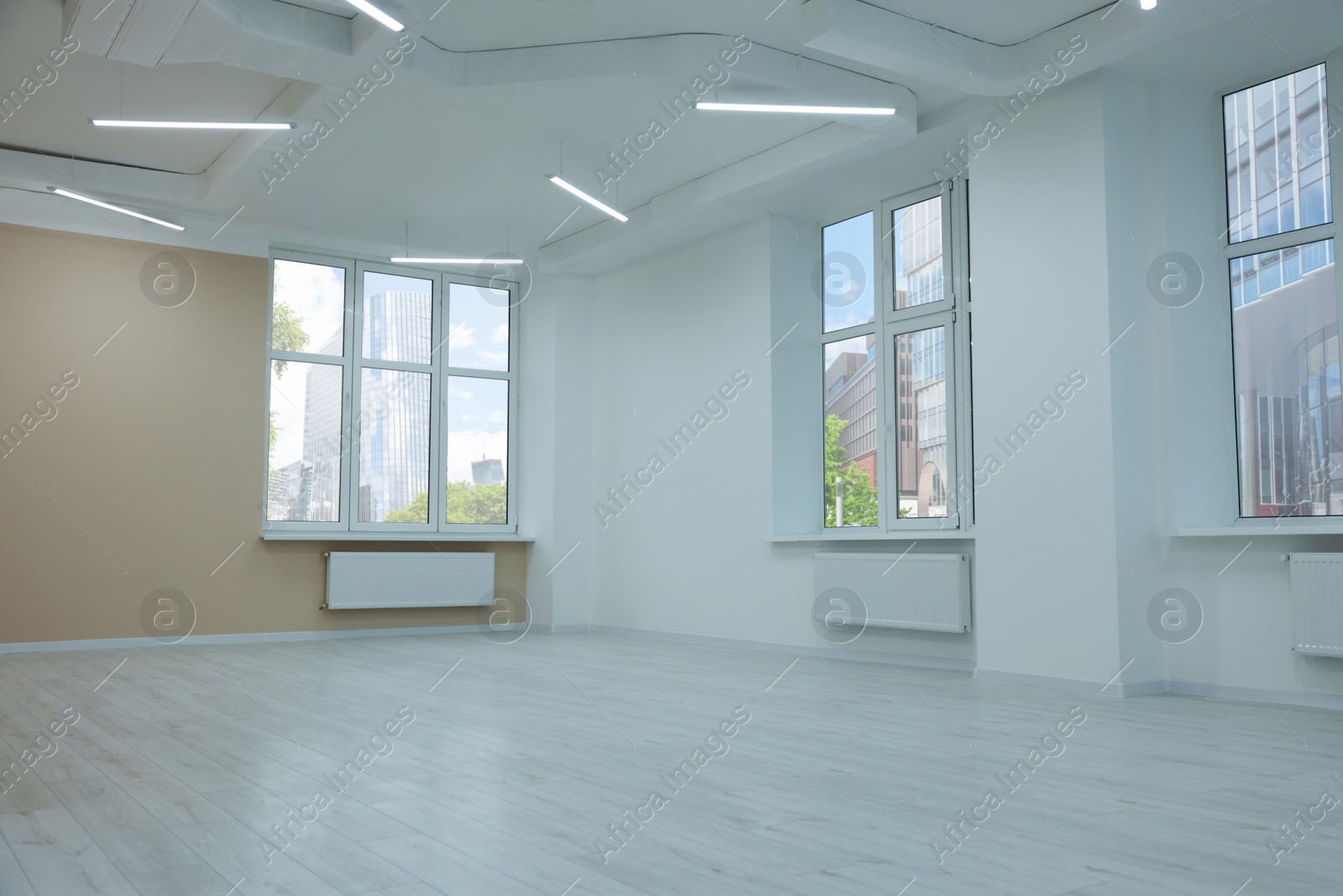 Photo of New empty room with clean windows and light walls