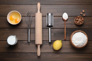 Cooking utensils and ingredients on wooden table, flat lay