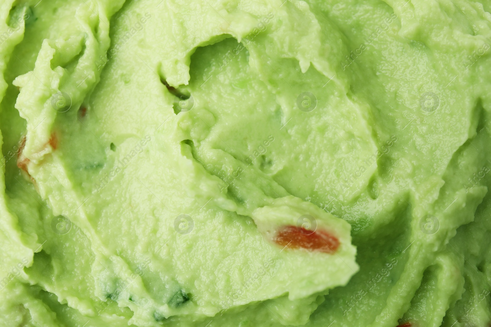 Photo of Delicious guacamole sauce as background, top view