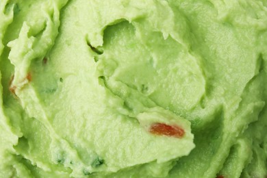 Photo of Delicious guacamole sauce as background, top view