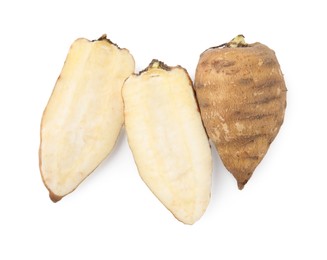 Photo of Whole and cut tubers of turnip rooted chervil isolated on white, top view