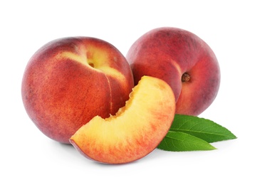 Sweet juicy peaches with leaves on white background