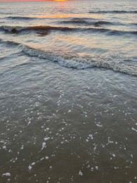 Photo of Beautiful view of sea waves at sunset