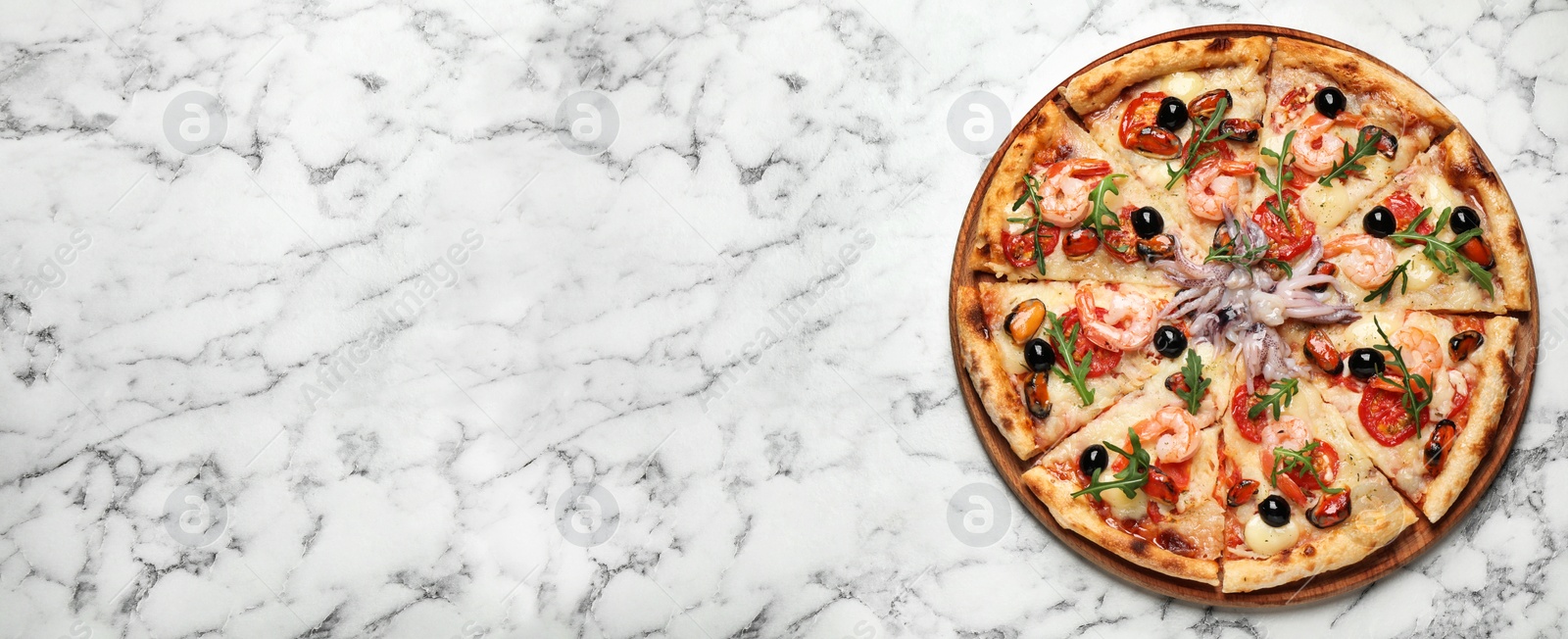 Image of Top view of hot delicious pizza on white marble table, space for text. Banner design 