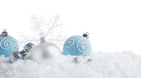 Christmas tree decoration on artificial snow against white background