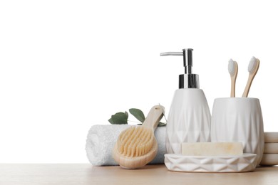 Bath accessories. Different personal care products on wooden table against white background. Space for text