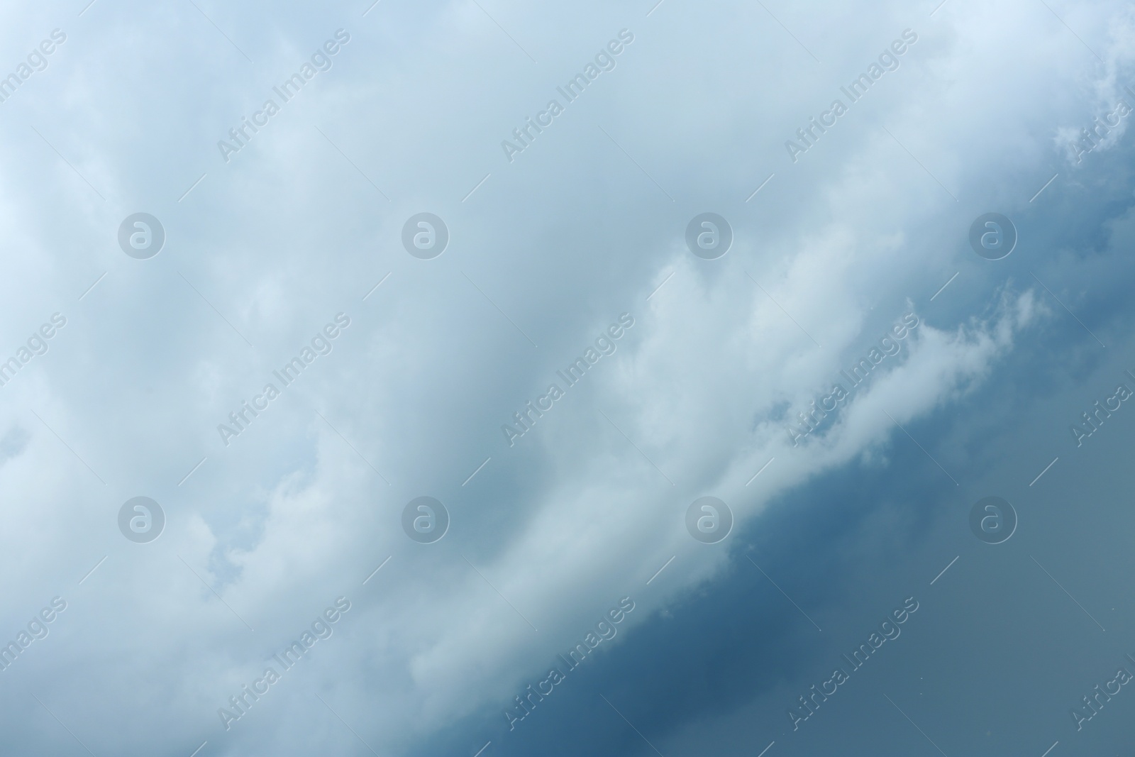 Photo of Sky with heavy rainy clouds on grey day