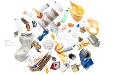 Image of Lots of different garbage flying on white background