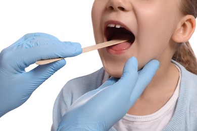 Photo of Doctor examining girl`s oral cavity with tongue depressor on white background, closeup