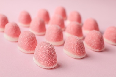 Photo of Sweet bright jelly candies on pink background