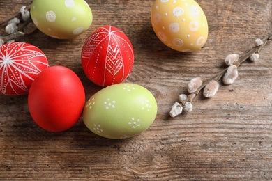 Colorful painted Easter eggs on wooden table