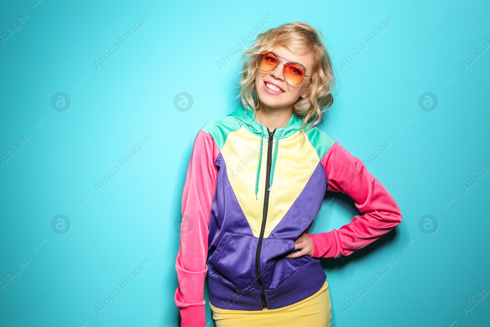 Photo of Stylish young woman posing on color background