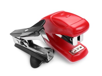 Photo of New bright stapler and staple remover isolated on white, closeup