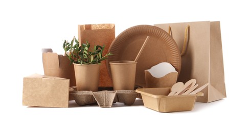 Eco friendly food packagings, tableware, paper bags and twigs isolated on white