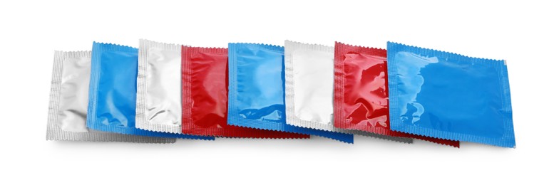 Photo of Condom packages isolated on white. Safe sex