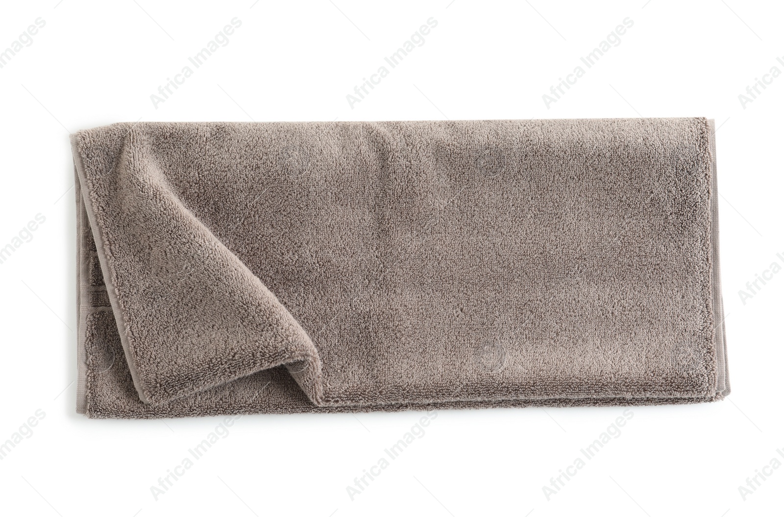 Photo of Soft folded towel isolated on white, top view