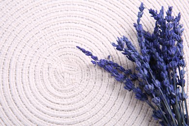 Photo of Bouquet of beautiful preserved lavender flowers on white cotton place mat, top view. Space for text