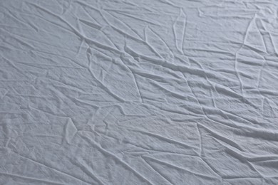 Crumpled white fabric as background, closeup view