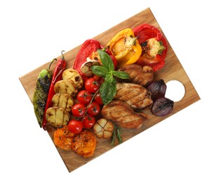 Photo of Wooden board with tasty grilled vegetables, meat, rosemary and basil isolated on white, top view