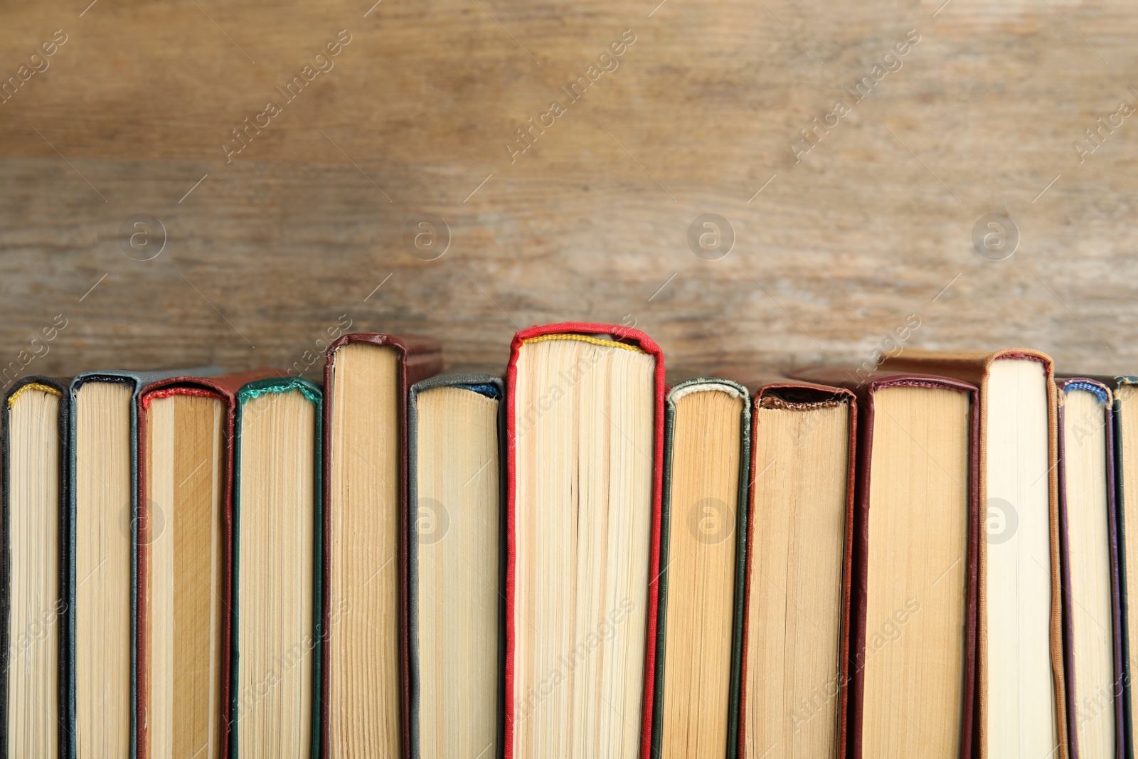 Photo of Collection of old books on wooden background