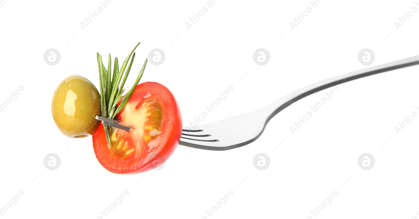 Photo of Fork with half of cherry tomato, olive and rosemary isolated on white