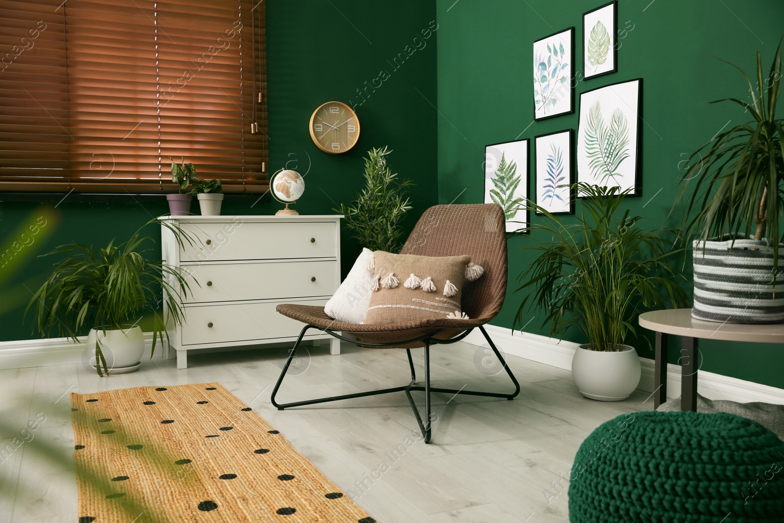 Photo of Elegant room interior with comfortable wicker armchair