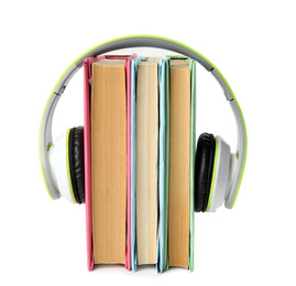 Books and modern headphones isolated on white
