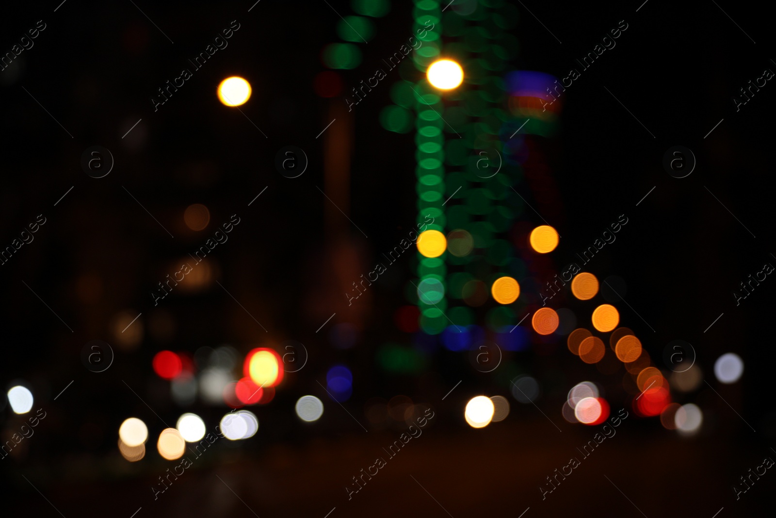 Photo of Blurred view of cityscape with bokeh effect. Night life