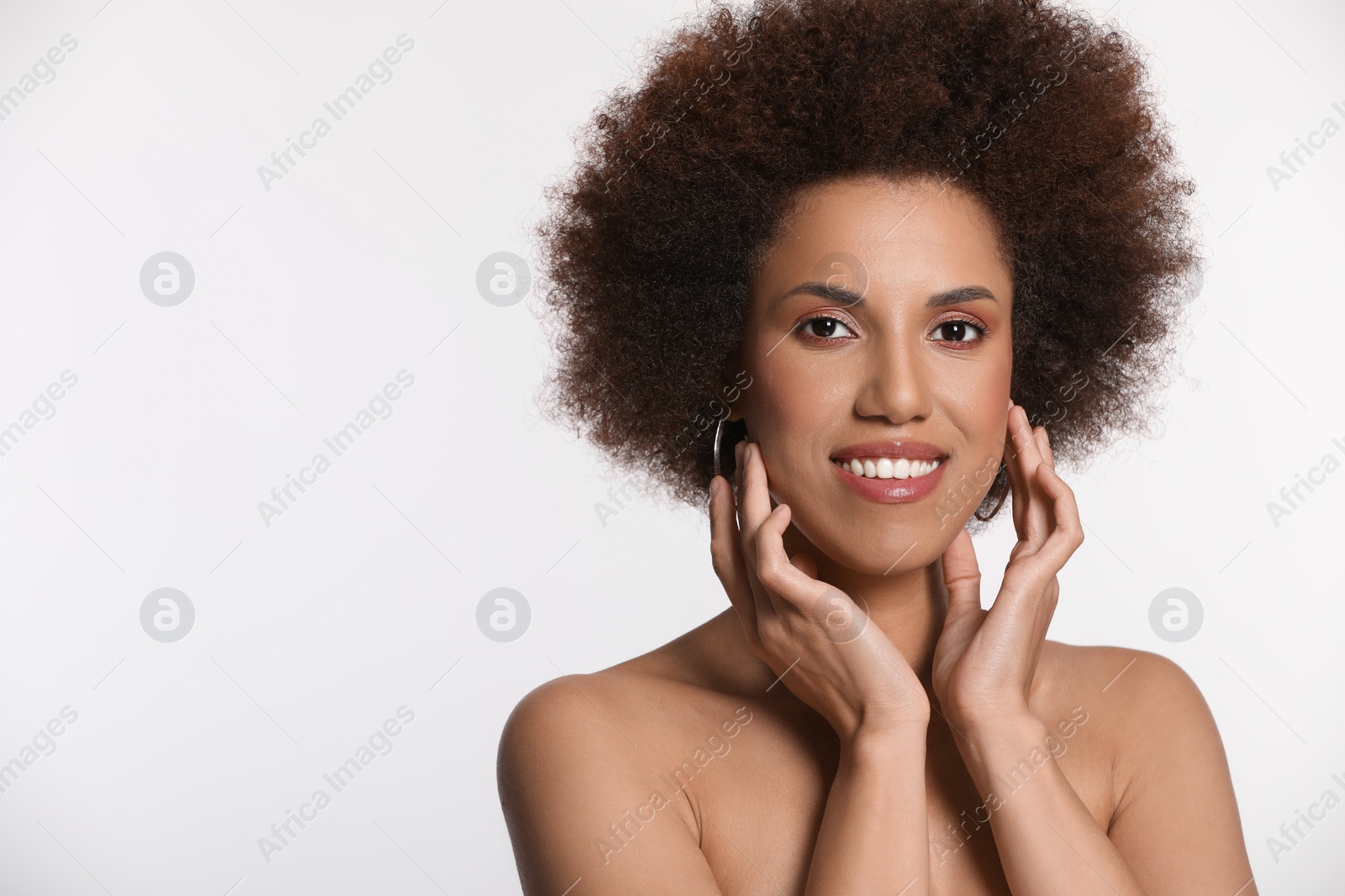 Photo of Portrait of beautiful young woman with glamorous makeup on white background. Space for text