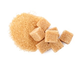 Photo of Granulated and cubed brown sugar on white background, top view