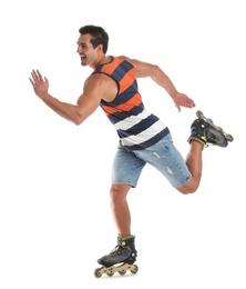 Photo of Handsome young man with inline roller skates on white background