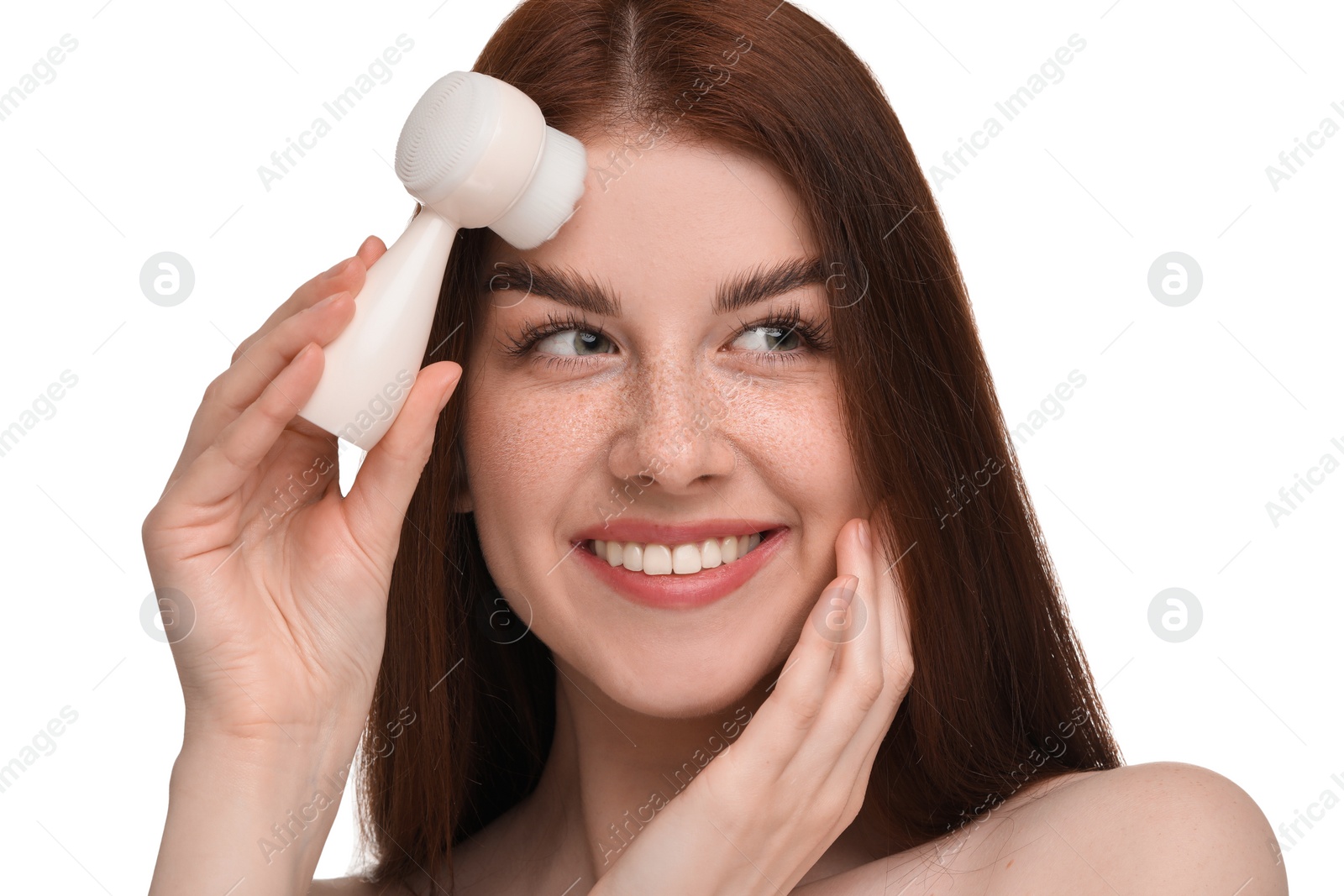 Photo of Washing face. Young woman with cleansing brush on white background