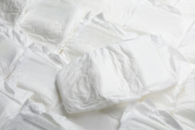 Photo of Baby diapers as background, closeup. Child's garment