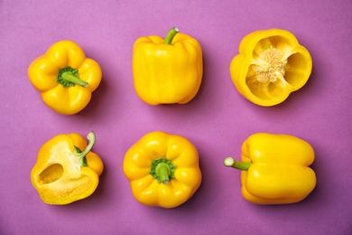 Flat lay composition with raw ripe paprika peppers on color background