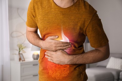 Healthcare service and treatment. Man suffering from abdominal pain in bathroom, closeup. Illustration of gastrointestinal tract