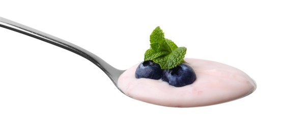 Photo of Spoon with yogurt, blueberries and mint isolated on white