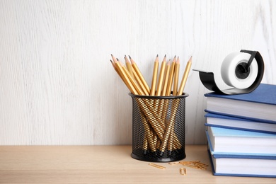 Photo of Different stationery on wooden table. Back to school