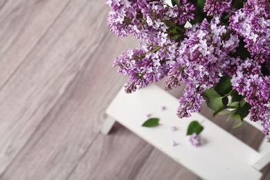 Photo of Blossoming lilac indoors. Spring flowers