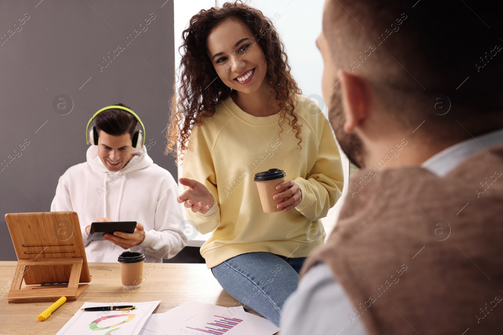 Photo of Team of employees working together in office. Startup project