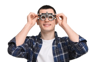 Photo of Vision testing. Young man with trial frame on white background