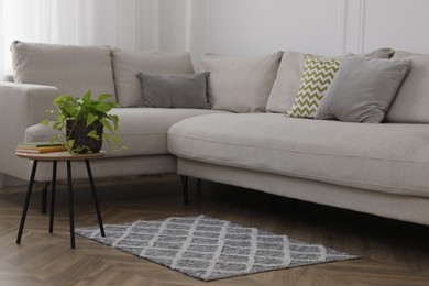 Photo of Modern living room interior with comfortable sofa and rug