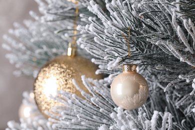 Photo of Beautiful Christmas tree with festive decor on brown background, closeup