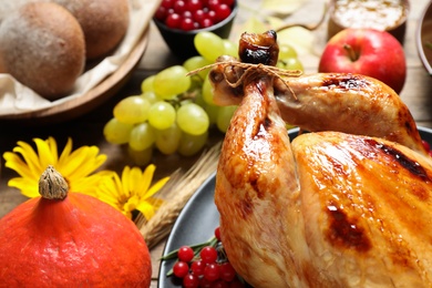 Photo of Composition with turkey on wooden background, closeup. Happy Thanksgiving day