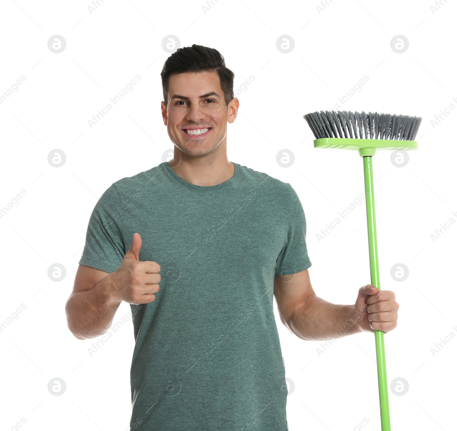 Photo of Man with green broom on white background