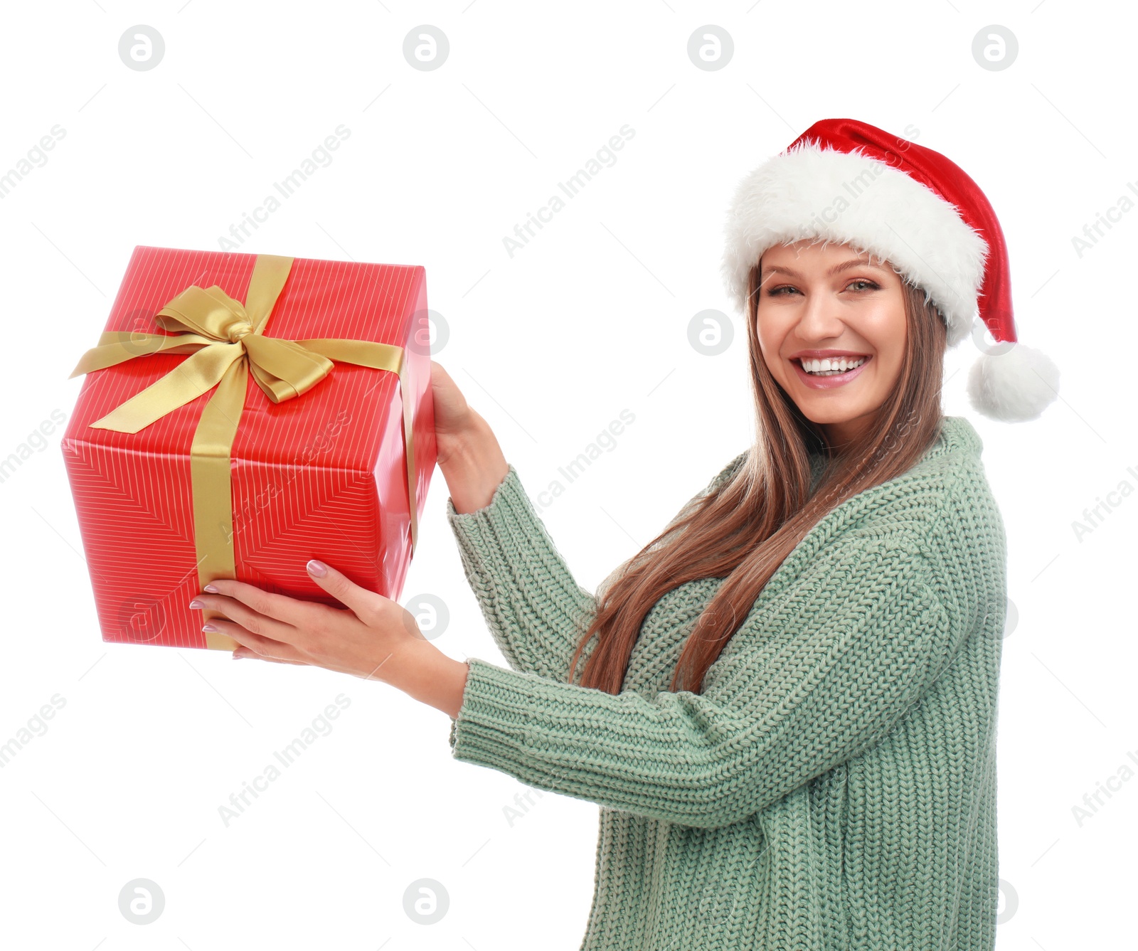 Photo of Happy young woman in Santa hat with Christmas gift on white background