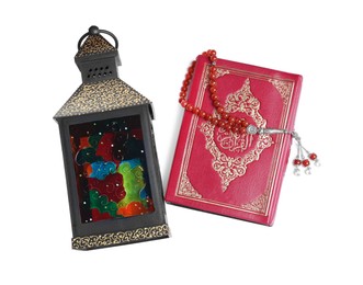 Decorative Arabic lantern, Quran and misbaha on white background, top view