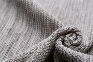 Photo of Beautiful grey knitted fabric as background, closeup