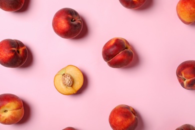 Photo of Flat lay composition with sweet juicy peaches on pink background