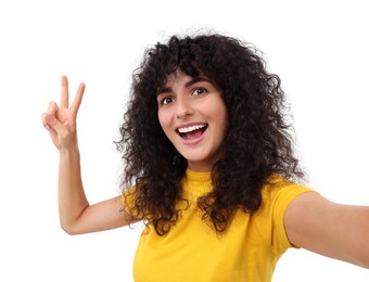 Photo of Beautiful young woman taking selfie on white background
