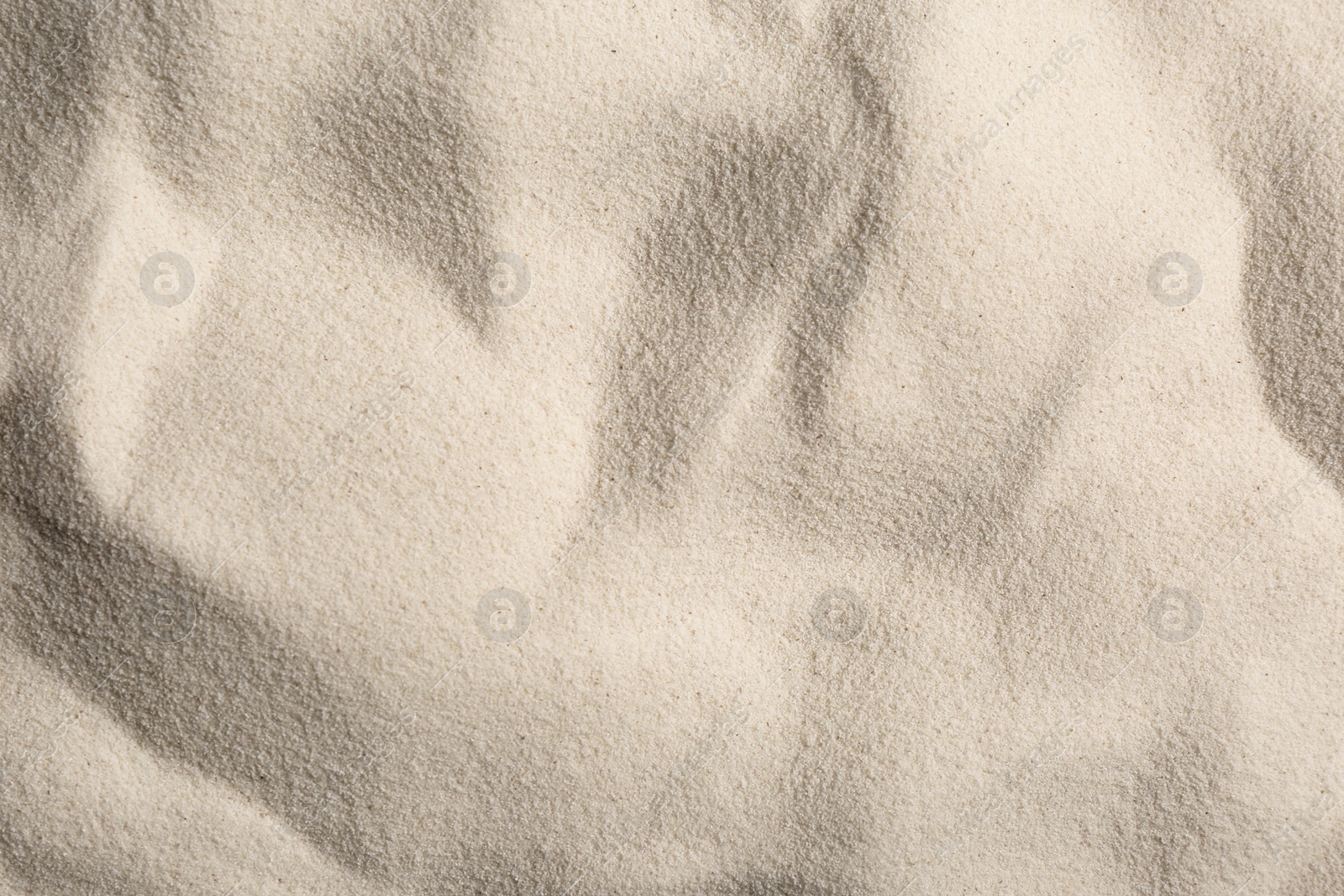 Photo of Uncooked organic semolina as background, closeup view